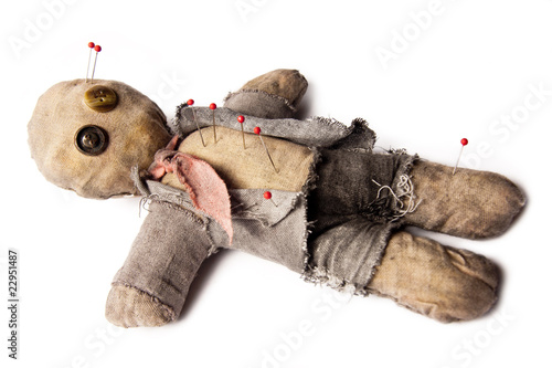 Foto: Photo of Businessman voodoo doll laying on white Photo of Businessman voodoo doll laying on white
