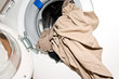 open washing machine with laundry
