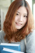 young asian girl in library young asian girl in library