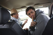 Couple silencing kids in a car