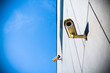 Security camera over blue sky Security camera over blue sky