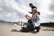 Boy and his father fishing