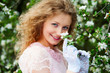 smiley model posing in white flowers