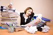 Young businesswoman with tons of documents