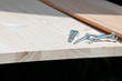 six steel screws on a wooden plank six steel screws on a wooden plank