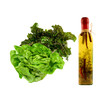 green salad with bootle of spiced olive oil