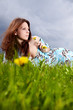Beautiful woman lying on the grass in the summer park
