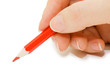The hand holds a red pencil The hand holds a red pencil