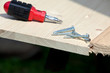 carpentry: screwdriver, screws and wood planks