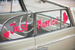 convertible car words just married painted on side window