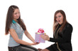 girl gives to the woman a gift.