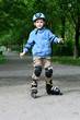 Preschooler learning to ride on rollerblades