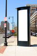 Tall billboard on the sidewalk
