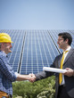 Photo: businessman and electrician shaking hands businessman and electrician shaking hands