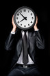Foto: man holding clock man holding clock