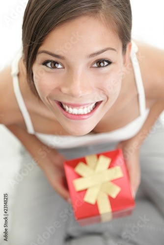 Photo: Woman holding gift Woman holding gift
