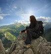 Woman on the top of a high mountain