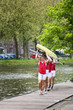 Oarsmen carrying a rowing boat
