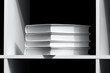 Books on a shelf over dark. WB image, special gray coloured