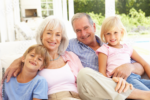Photo: Portrait Of Grandparents With Grandchildren Relaxing Together Portrait Of Grandparents With Grandchildren Relaxing Together