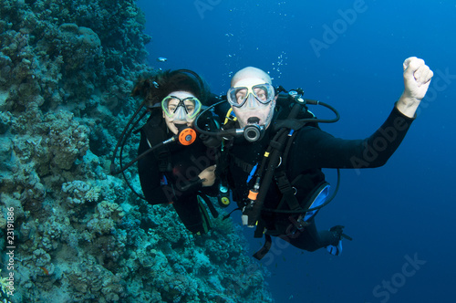 Photo: couple scuba diving couple scuba diving