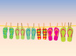 Flip-flops on a rope with the evening sky behind
