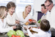 Grandmother with family laughing in kitchen