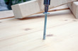 screwdriver, screw and wood planks screwdriver, screw and wood planks