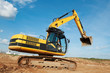loader excavator moving in a quarry