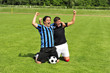 Zwei Fussballspieler jubeln auf dem Fussballplatz Zwei Fussballspieler jubeln auf dem Fussballplatz