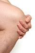 male knee with hand on white background