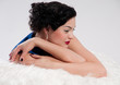 Closeup beautiful glamour woman on white fur Closeup beautiful glamour woman on white fur