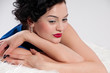 Closeup beautiful glamour woman on white fur Closeup beautiful glamour woman on white fur