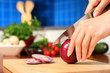 Female chopping food ingredients. Female chopping food ingredients.