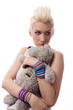 Beautiful girl with blonde hair and toy bear