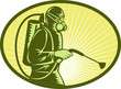 Pest control exterminator spraying side view Pest control exterminator spraying side view