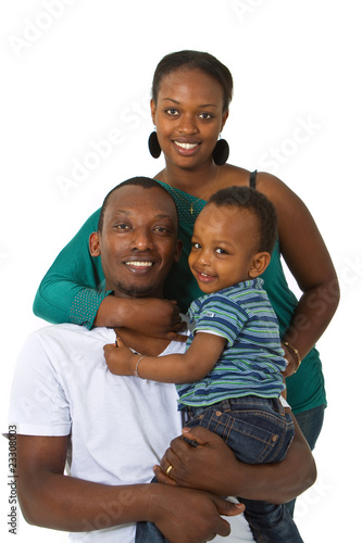 Photo: Young afro american family in a studio setting. Young afro american family in a studio setting.