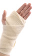 Bandaged woman hand isolated on white background