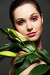 attractive woman with green leafs
