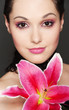young attractive woman with pink lily