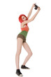 Red-hair young girl with photocamera isolated on white Red-hair young girl with photocamera isolated on white