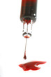 Spritze mit Blut und Herz aus Zucker