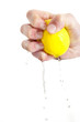 Hand squeezing lemon