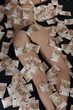Photo: A woman lying on the bed is covered with fifty Euro banknotes A woman lying on the bed is covered with fifty Euro banknotes