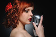 Attractive redhead woman with retro microphone Attractive redhead woman with retro microphone