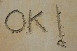 ok word spell written on beach wet sand ok word spell written on beach wet sand
