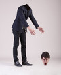 Headless business man searches his head.