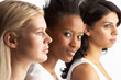 Portrait Of Three Attractive Young Women In Studio Standing In L