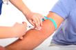 Photo: Taking blood sample from patience's arm Taking blood sample from patience's arm