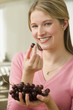 Woman Eating Grapes